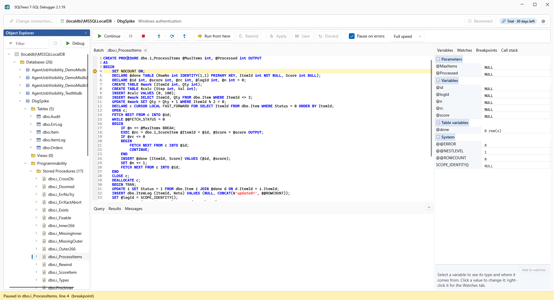A breakpoint in the batch that calls a stored procedure, with the debugger paused at it